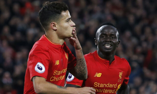 Britain Soccer Football - Liverpool v West Bromwich Albion - Premier League - Anfield - 22/10/16
Liverpool's Philippe Coutinho celebrates scoring their second goal with Sadio Mane
Action Images via Reuters / Ed Sykes
Livepic
EDITORIAL USE ONLY. No use with unauthorized audio, video, data, fixture lists, club/league logos or "live" services. Online in-match use limited to 45 images, no video emulation. No use in betting, games or single club/league/player publications. Please contact your account representative for further details.